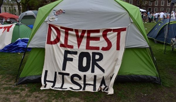 A sign in the Brown University student encampment showing support for junior Hisham Awartani
