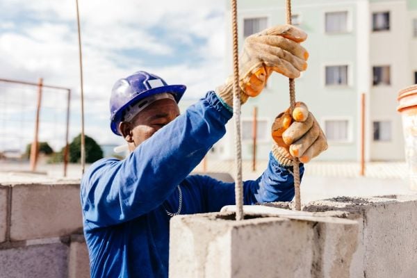 A Black man doing construction work