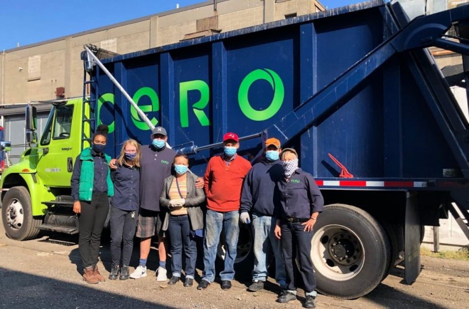 Cero workers in front of one of their trucks