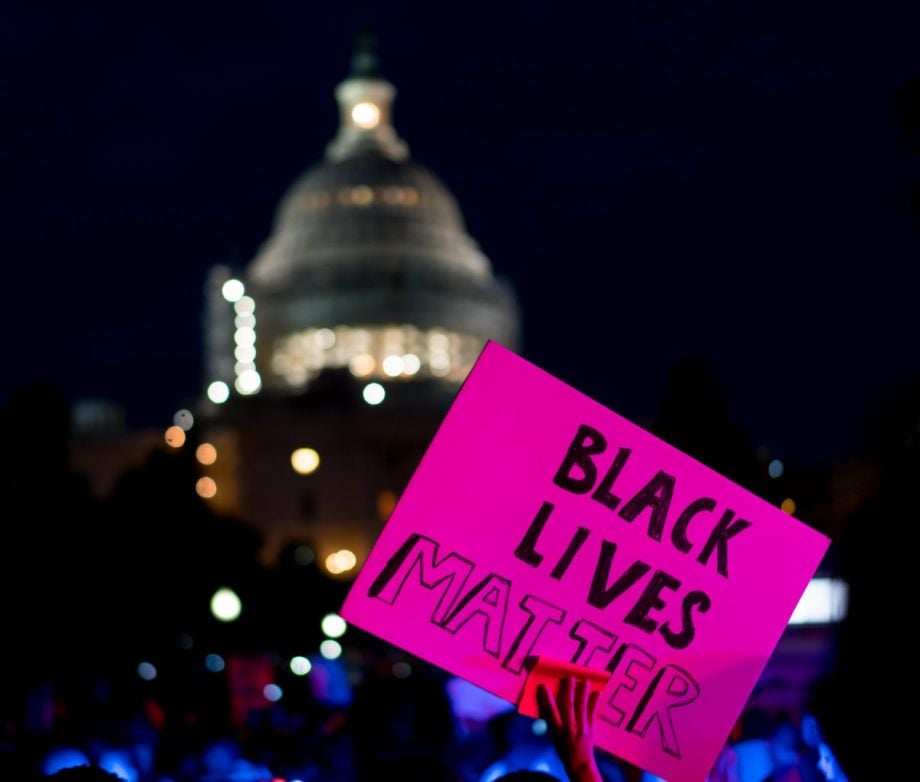 A protestor holds a Black Lives Matter sign during a rally from the White House to the Capitol, July 8, 2016.