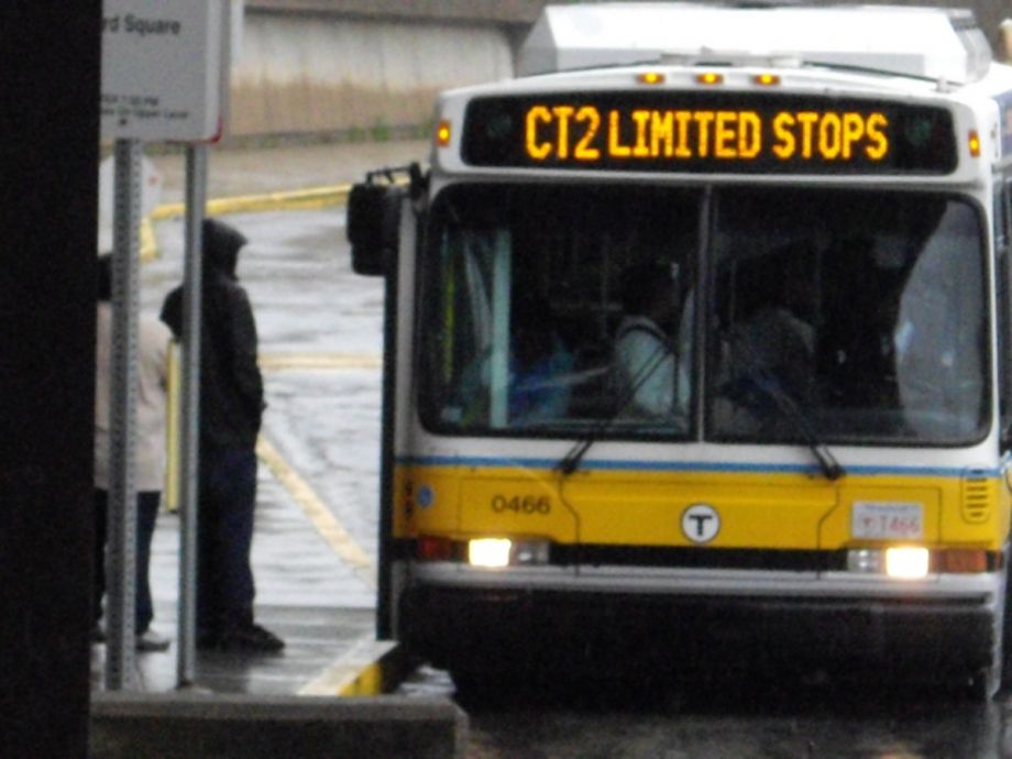 A person boarding an MBTA bus in Boston