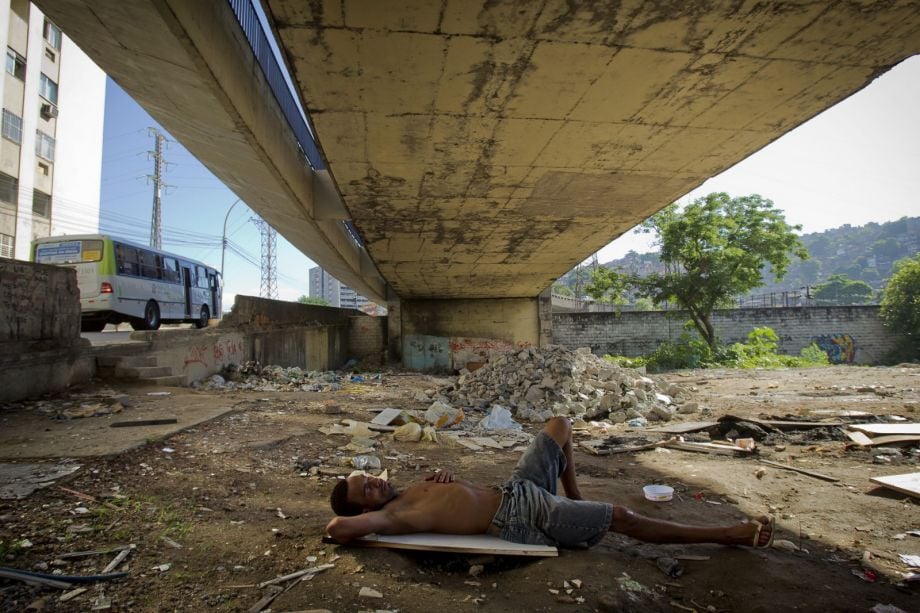 A man sleeping under a bridge
