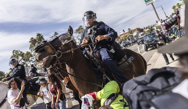The LAPD charges at peaceful protesters following the ''No Kings'' protest in Downtown Los Angeles, United States.