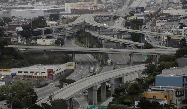 Light traffic drives on Interstate 280, Highway 101 and city streets in San Francisco, Tuesday, March 24, 2020.