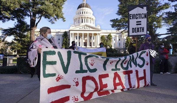 Demonstrators calling for lawmakers and Gov. Gavin Newsom to pass rent forgiveness and stronger eviction protections legislation, gather in front of the Capitol in Sacramento, Calif., on Monday, Jan. 25, 2021.