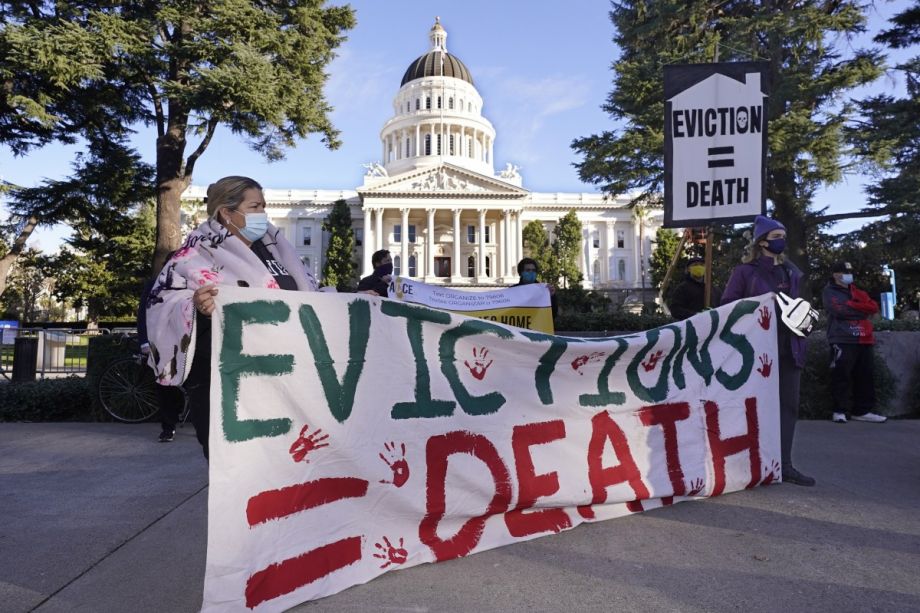 Demonstrators calling for lawmakers and Gov. Gavin Newsom to pass rent forgiveness and stronger eviction protections legislation, gather in front of the Capitol in Sacramento, Calif., on Monday, Jan. 25, 2021. 