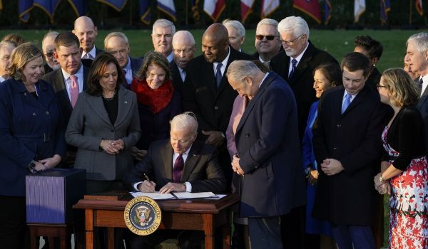 President Joe Biden signs the $1.2 trillion bipartisan infrastructure bill into law during a ceremony on the South Lawn of the White House in Washington on Nov. 15, 2021.