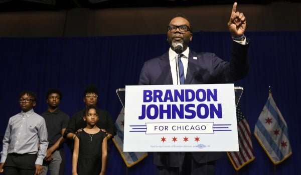 Brandon Johnson, a Black man, speaks on stage