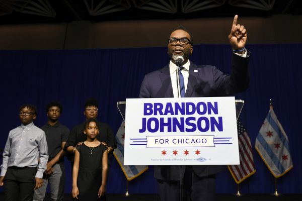 Brandon Johnson, a Black man, speaks on stage