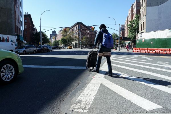 Person walks across a street in Brooklyn