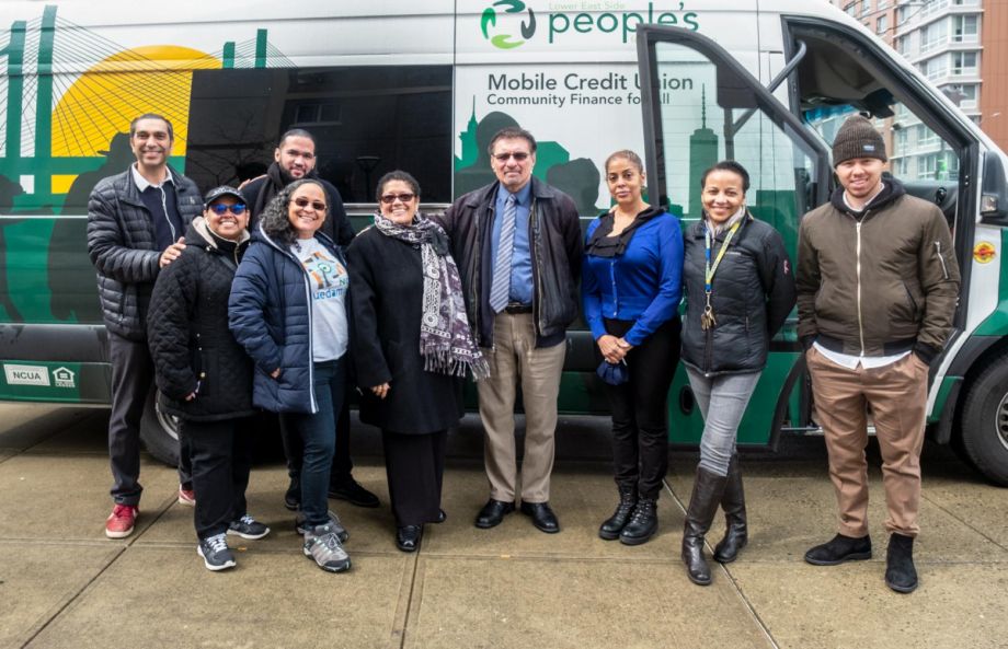 Bronx Financial Access Coalition members stand in front of their mobile bank van