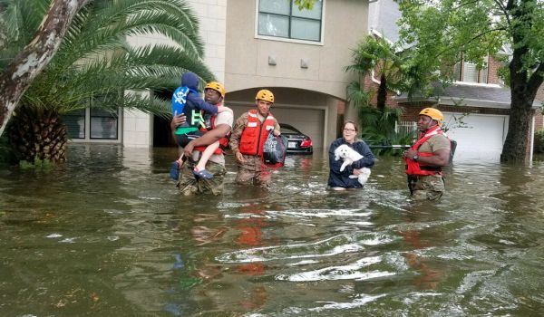 Residents leave their homes amid floods.