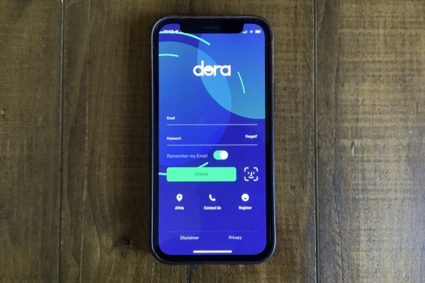 Phone showing Dora app login screen