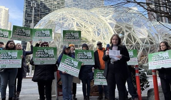 Social housing advocates rally outside Seattle's Amazon Spheres after the company dumped $100,000 into the opposition campaign. (Photo courtesy House Our Neighbors)