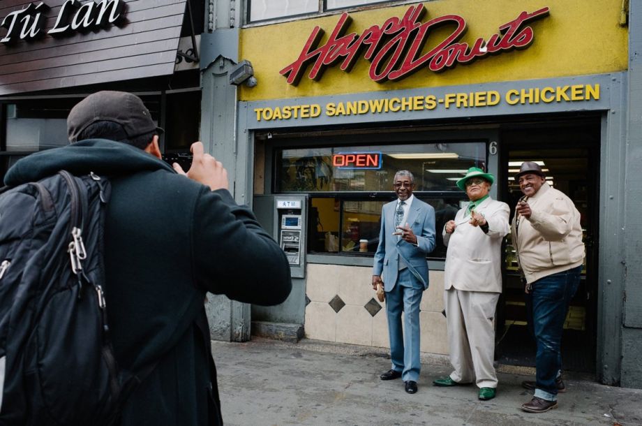 CatchLight fellow Felix Uribe photographing a group of men in the Tenderloin, San Francisco.