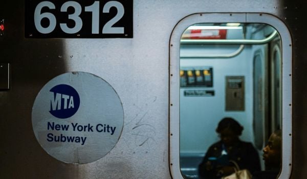 The exterior of a train with the numbers '6312' and a sticker that reads 'MTA New York City Subway'