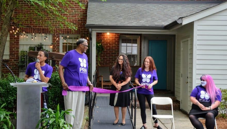 Founder and CEO of Promise Resource Network Cherene Allen-Caraco, center, at the ribbon-cutting ceremony for the mental health agency's peer-run respite. 
