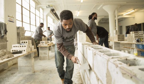 Students at The Trade Institute of Pittsburgh, many of whom were formerly incarcerated, learn masonry and carpentry at 7800 Susquehanna