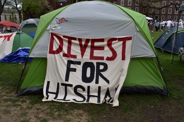A sign in the Brown University student encampment showing support for junior Hisham Awartani