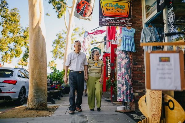 Elderly Asian Couple Walking on the Street