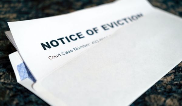 Close up of a Notice of Eviction tucked inside an envelope