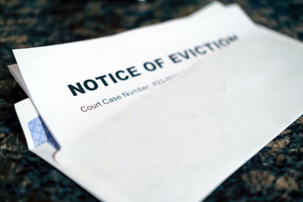 Close up of a Notice of Eviction tucked inside an envelope