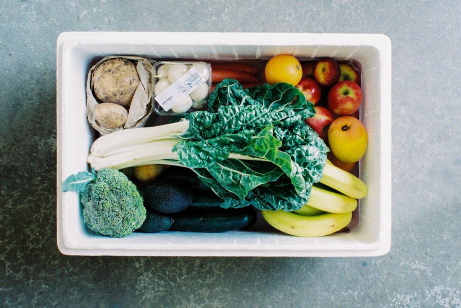 White box filled with fruits and vegetables