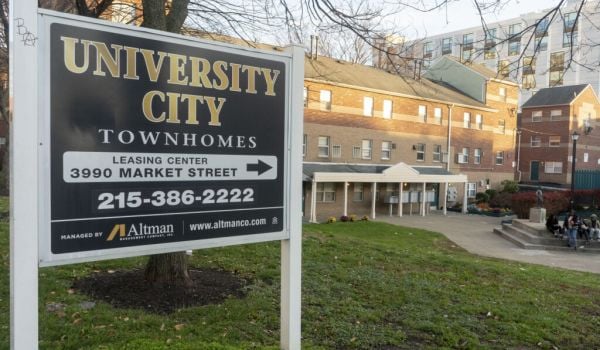 Leasing sign in front of University City Townhomes