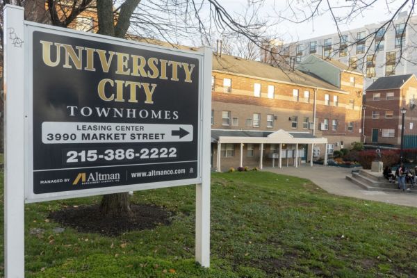 Leasing sign in front of University City Townhomes