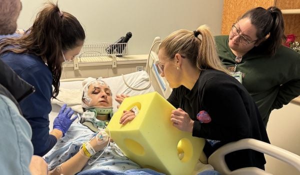 Dr. Anna Cornelius-Schecter in the hospital following the car crash.