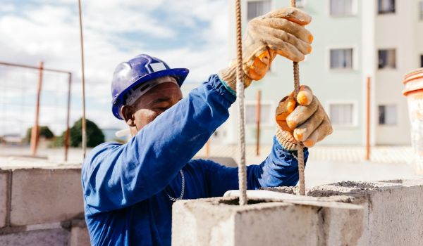 A Black man doing construction work