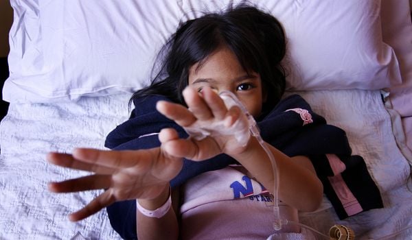 A young patient recovering from surgery in the hospital.