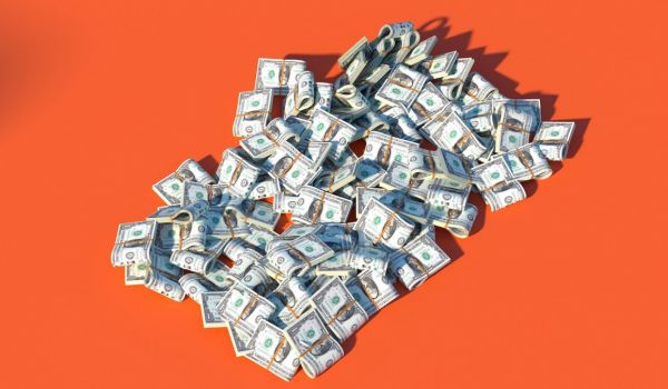 A pile of money on an orange background.