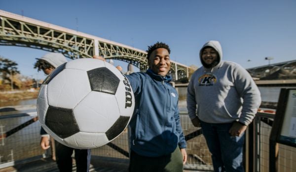 Youth play soccer near Cleveland’s Lake Link Trail.