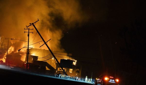 Homes ablaze on the Pacific Coast Highway during the Palisades Fire.
