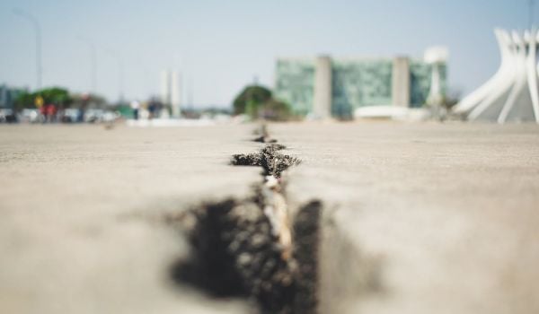 Cracks in a sidewalk.
