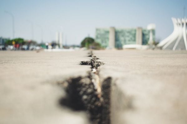Cracks in a sidewalk.