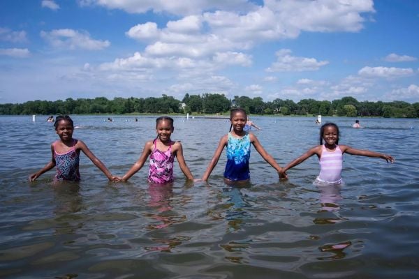 Girls enjoying the water at Lake Phalen Beach in St. Paul, Minnesota