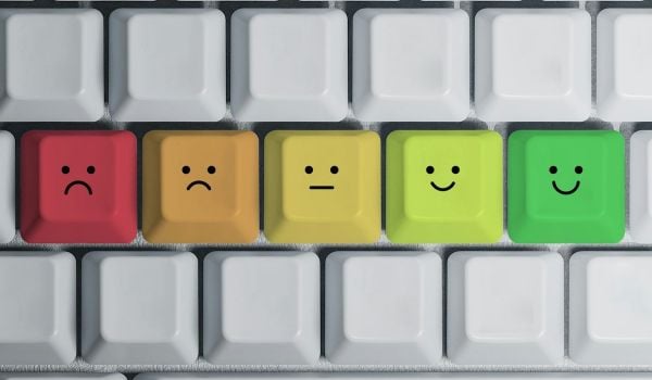 A computer keyboard with smiley faces.